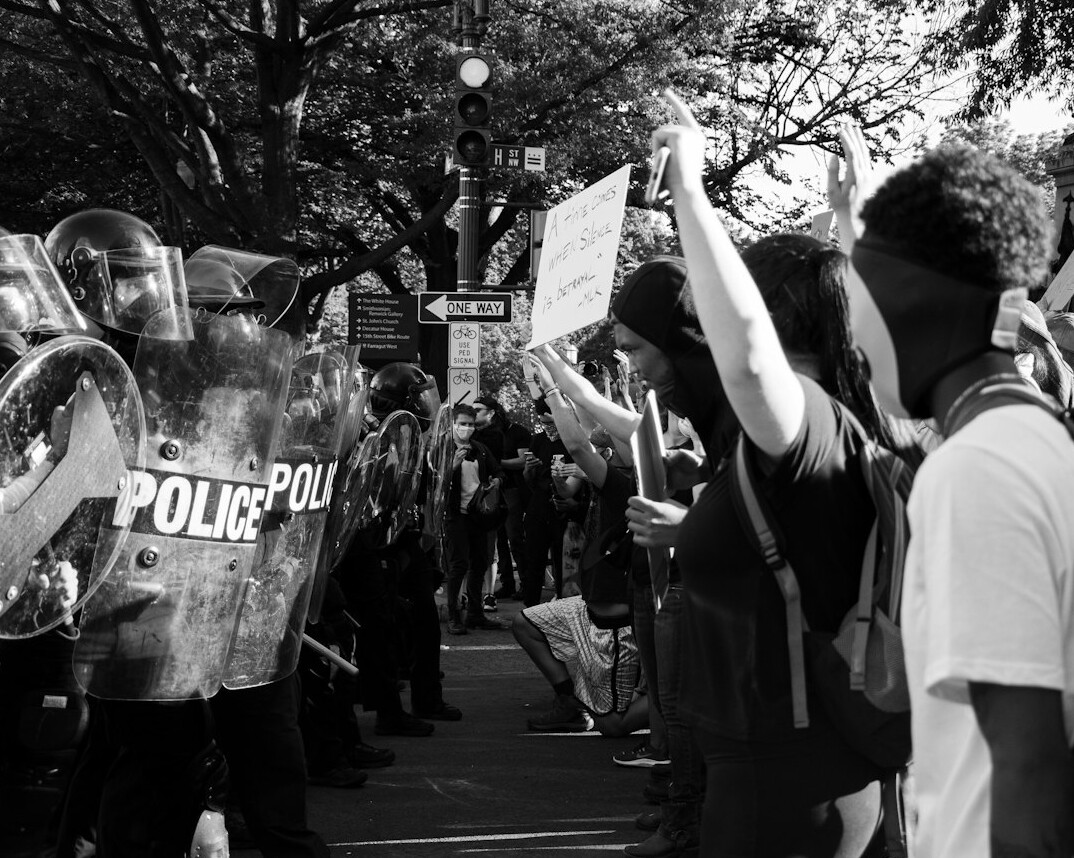 crowd protesting corporations